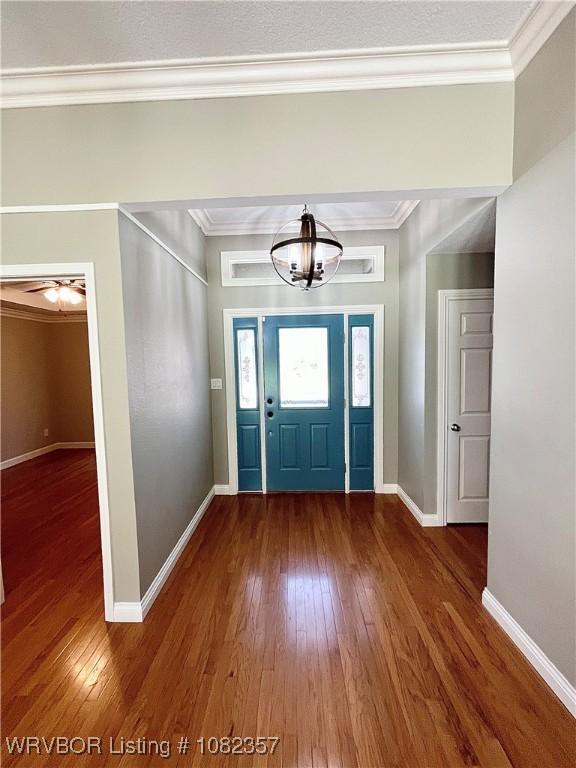4104 Glen Flora Way, Fort Smith, AR 72908 - entryway with hardwood / wood-style flooring, a chandelier, and crown molding