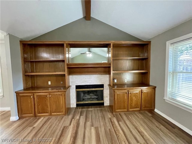 4104 Glen Flora Way, Fort Smith, AR 72908 - unfurnished living room featuring a ceiling fan, light wood-type flooring, and a brick fireplace