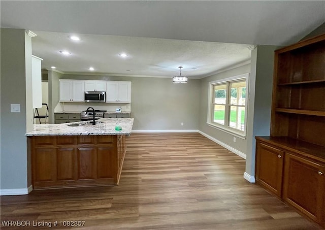 4104 Glen Flora Way, Fort Smith, AR 72908 - kitchen featuring crown molding, stainless steel microwave, white cabinetry, wood finished floors, and recessed lighting