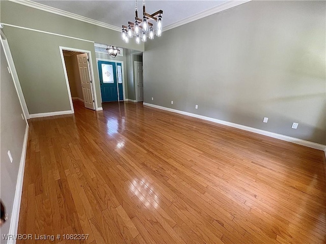 4104 Glen Flora Way, Fort Smith, AR 72908 - empty room featuring a chandelier, crown molding, and hardwood / wood-style floors