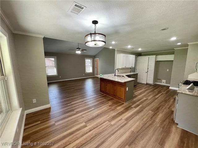 4104 Glen Flora Way, Fort Smith, AR 72908 - kitchen with a ceiling fan, ornamental molding, dark wood-style floors, open floor plan, and light stone counters