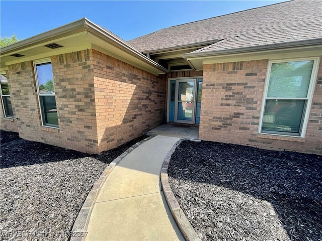 4104 Glen Flora Way, Fort Smith, AR 72908 - view of exterior entry featuring brick siding and roof with shingles