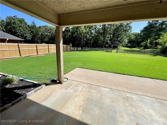 4104 Glen Flora Way, Fort Smith, AR 72908 - fenced backyard featuring a patio area and view of scattered trees