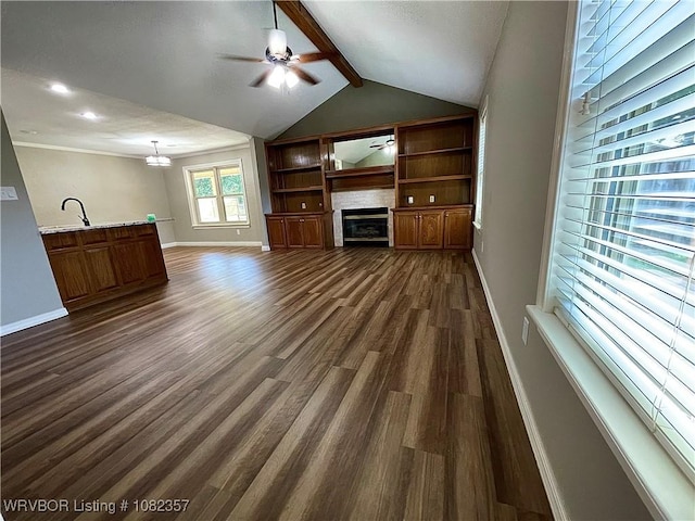 4104 Glen Flora Way, Fort Smith, AR 72908 - unfurnished living room with a ceiling fan, dark wood finished floors, a glass covered fireplace, built in shelves, and recessed lighting