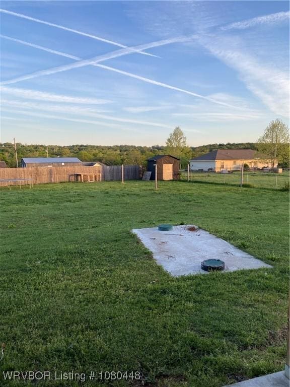 1111 Bluebird Dr, Cedarville, AR 72932 - view of yard with a fenced backyard, an outdoor structure, and a shed