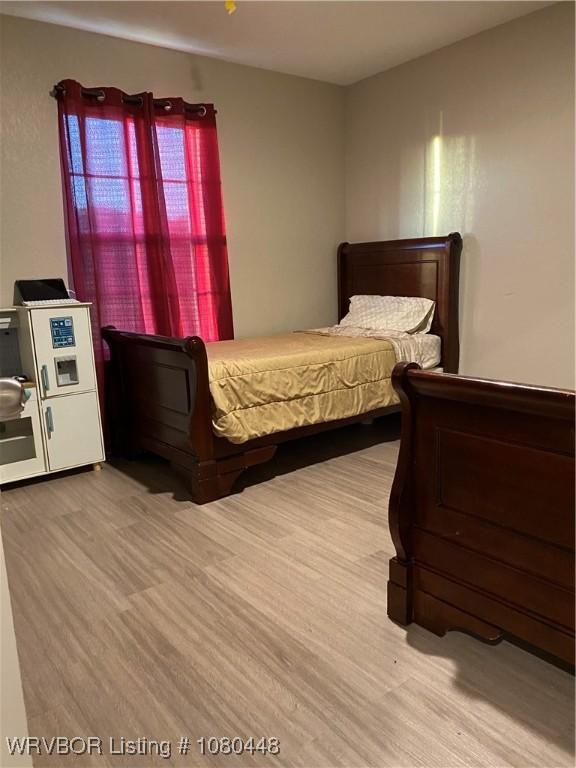 1111 Bluebird Dr, Cedarville, AR 72932 - bedroom with wood finished floors