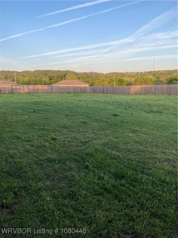 1111 Bluebird Dr, Cedarville, AR 72932 - view of yard featuring a rural view and a fenced backyard