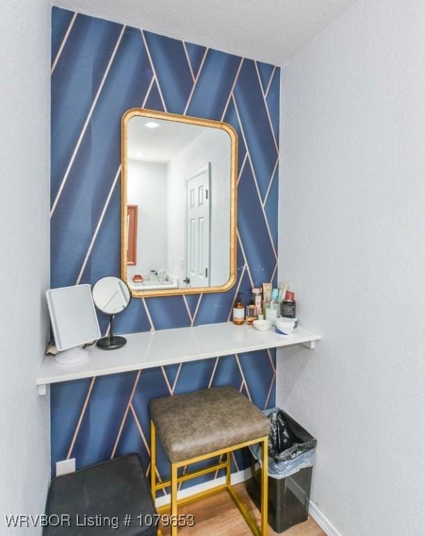 details featuring baseboards and wood finished floors