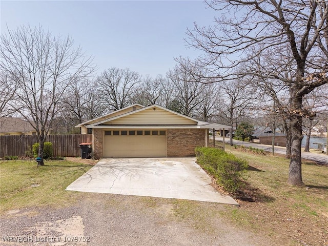 8437 Sebastian Lake Dr, Hackett, AR 72937 - exterior space with driveway, fence, a garage, brick siding, and a yard