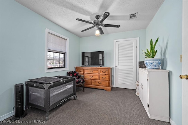 8437 Sebastian Lake Dr, Hackett, AR 72937 - bedroom featuring carpet, visible vents, a ceiling fan, baseboards, and a textured ceiling