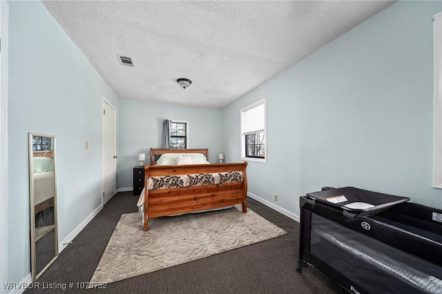 8437 Sebastian Lake Dr, Hackett, AR 72937 - bedroom featuring baseboards, dark colored carpet, visible vents, and a textured ceiling