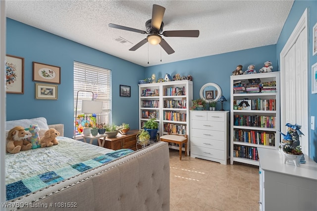 2027 High Meadow Ln, Alma, AR 72921 - bedroom with a textured ceiling, a ceiling fan, and light tile patterned flooring
