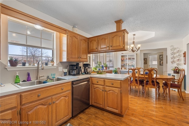 2027 High Meadow Ln, Alma, AR 72921 - kitchen with dishwasher, a sink, a peninsula, a textured ceiling, and light countertops