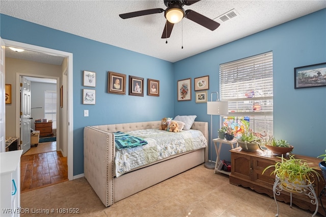 2027 High Meadow Ln, Alma, AR 72921 - bedroom with a textured ceiling, a ceiling fan, and baseboards