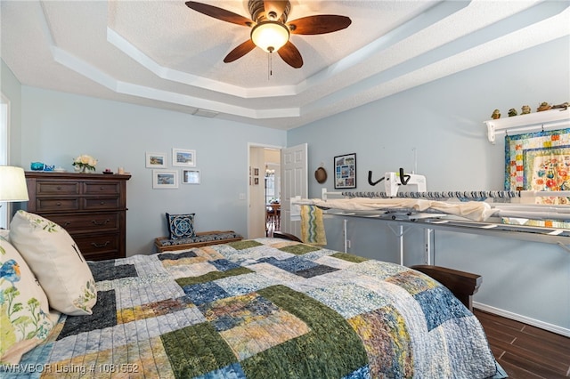 2027 High Meadow Ln, Alma, AR 72921 - bedroom with a tray ceiling, wood finished floors, and ceiling fan