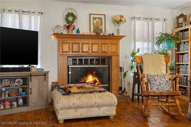2027 High Meadow Ln, Alma, AR 72921 - sitting room with hardwood / wood-style flooring and a glass covered fireplace