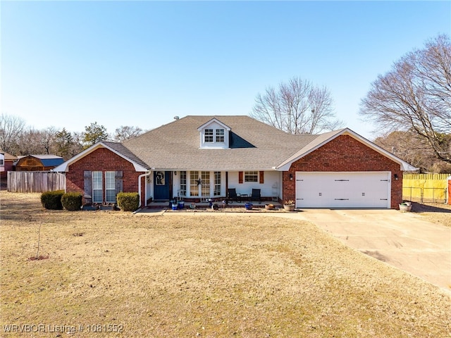 2027 High Meadow Ln, Alma, AR 72921 - view of front of property featuring brick siding, a porch, concrete driveway, and a garage