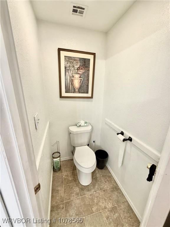 bathroom featuring toilet