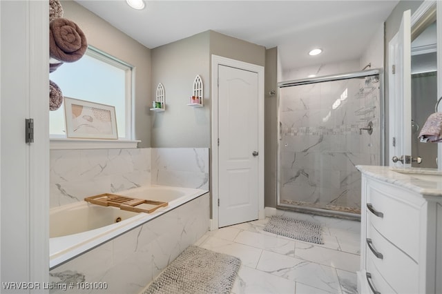 full bathroom with marble finish flooring, a marble finish shower, a garden tub, vanity, and recessed lighting