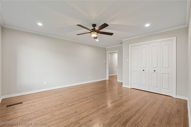 unfurnished bedroom with a closet, ceiling fan, ornamental molding, and light hardwood / wood-style floors