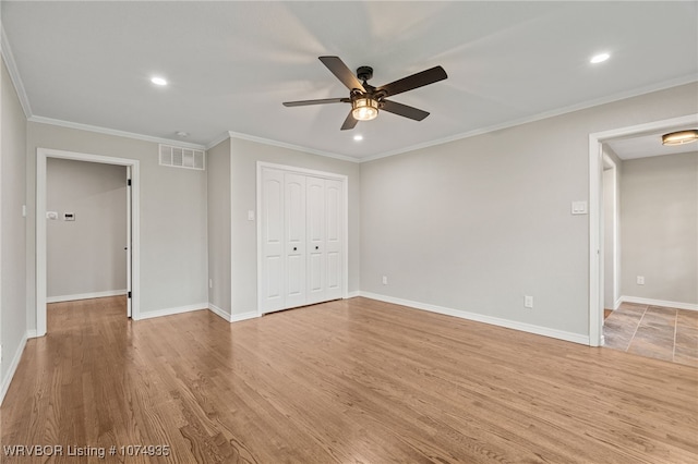 interior space with crown molding, ceiling fan, and light hardwood / wood-style floors