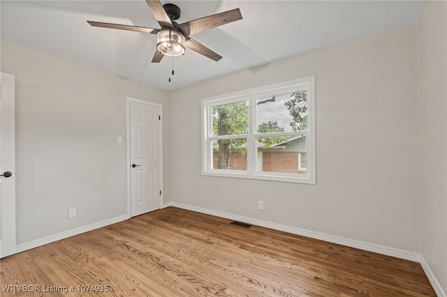 spare room featuring ceiling fan and light hardwood / wood-style floors