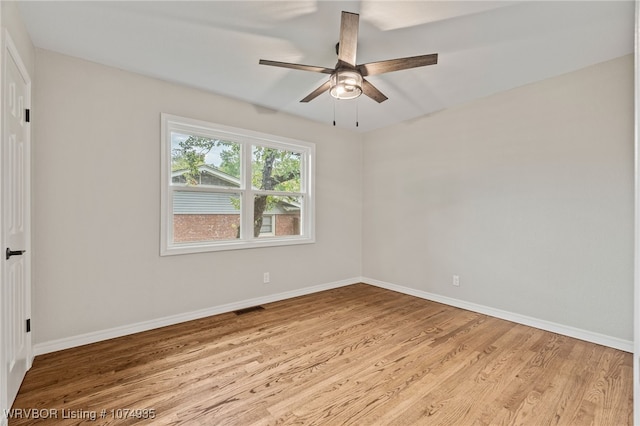 spare room featuring ceiling fan and light hardwood / wood-style flooring