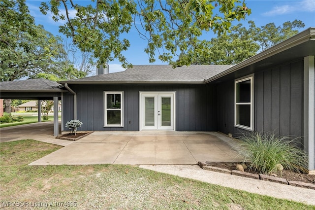 back of property featuring french doors and a patio area