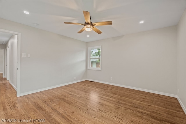 unfurnished room featuring ceiling fan and light hardwood / wood-style floors