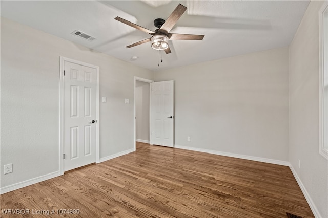 unfurnished room featuring hardwood / wood-style flooring and ceiling fan