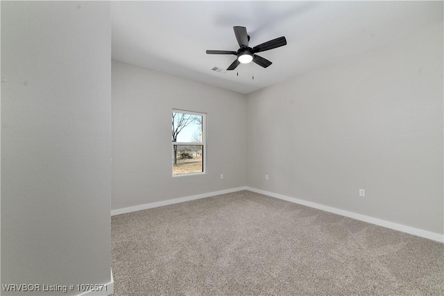 spare room featuring carpet and ceiling fan