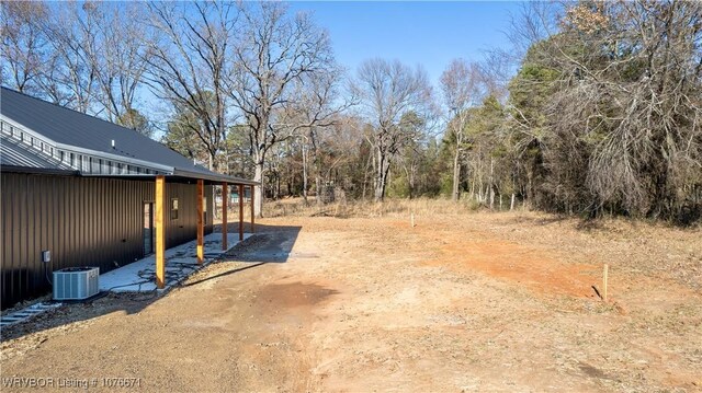 view of yard with central AC