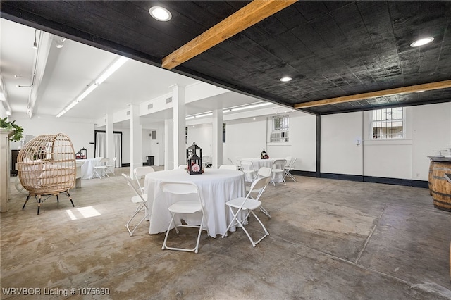 dining space featuring concrete floors