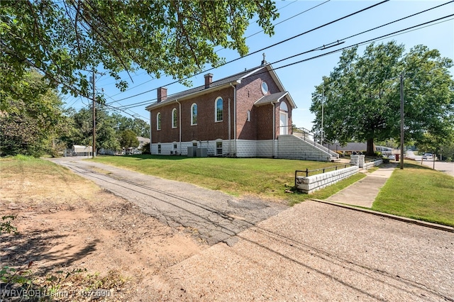 view of home's exterior featuring a lawn