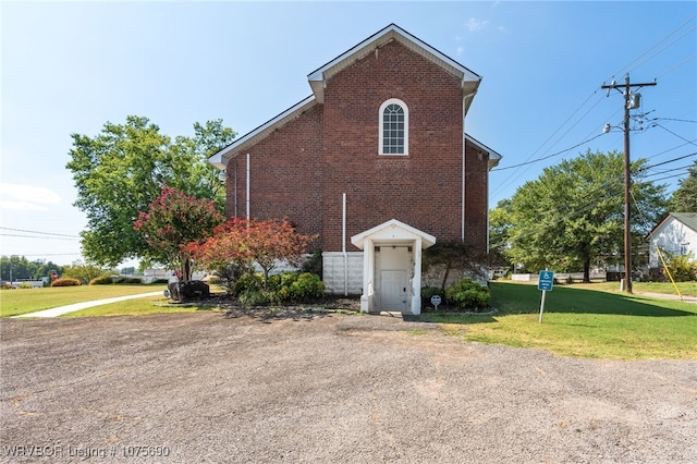 view of property exterior with a yard