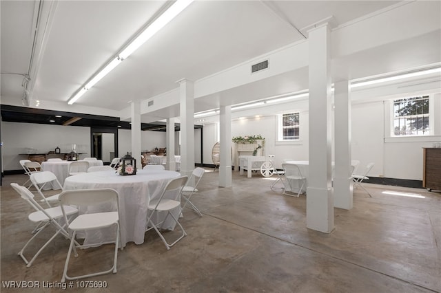 dining area with concrete flooring