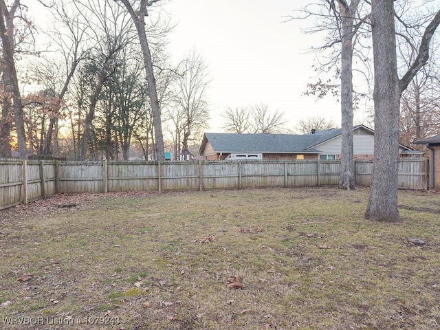 view of yard with a fenced backyard