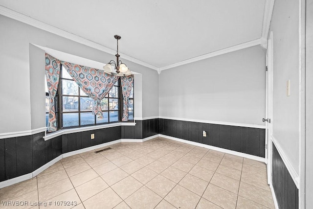 interior space with light tile patterned floors, wainscoting, visible vents, and an inviting chandelier