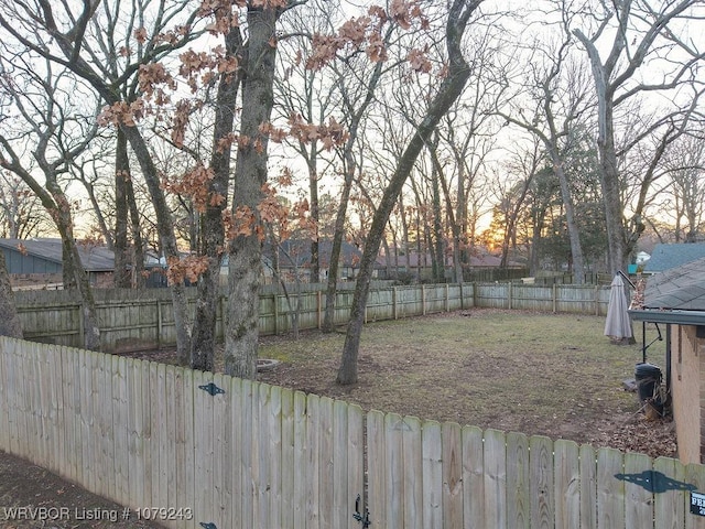 view of yard with a fenced backyard