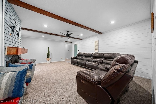 living room featuring carpet floors, beam ceiling, ceiling fan, and baseboards