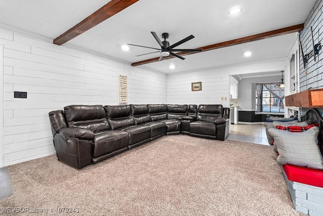 living area featuring ceiling fan, carpet flooring, wood walls, beam ceiling, and recessed lighting