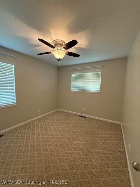 503 E Mayo Dr, Sallisaw, OK 74955 - spare room with carpet and ceiling fan