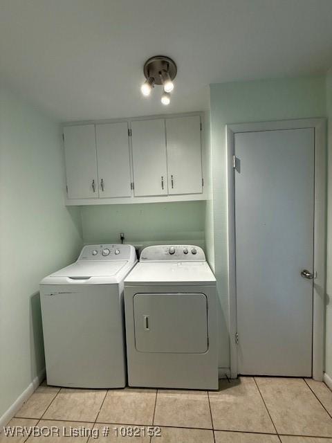 503 E Mayo Dr, Sallisaw, OK 74955 - laundry area featuring cabinet space, washer and dryer, and light tile patterned flooring
