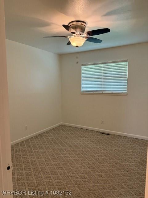 503 E Mayo Dr, Sallisaw, OK 74955 - carpeted spare room with ceiling fan and baseboards