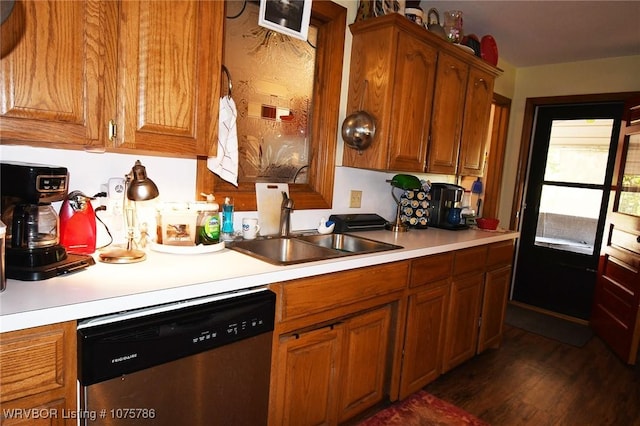 kitchen featuring dishwasher, dark hardwood / wood-style flooring, and sink