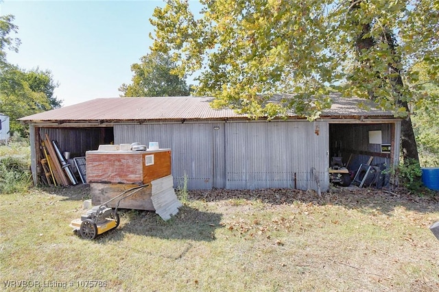 view of outdoor structure featuring a lawn