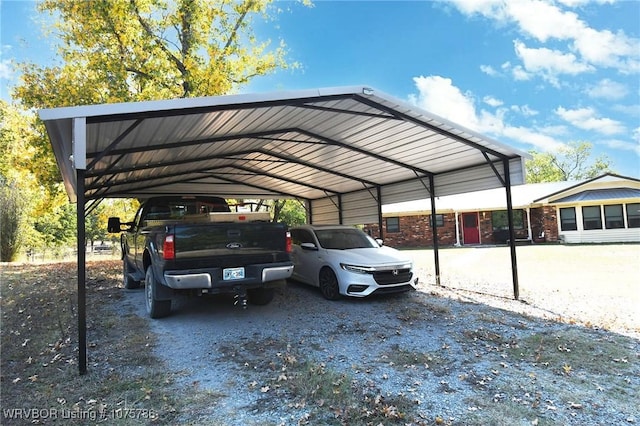 view of vehicle parking with a carport