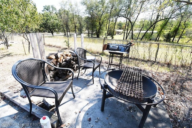 view of patio with a fire pit