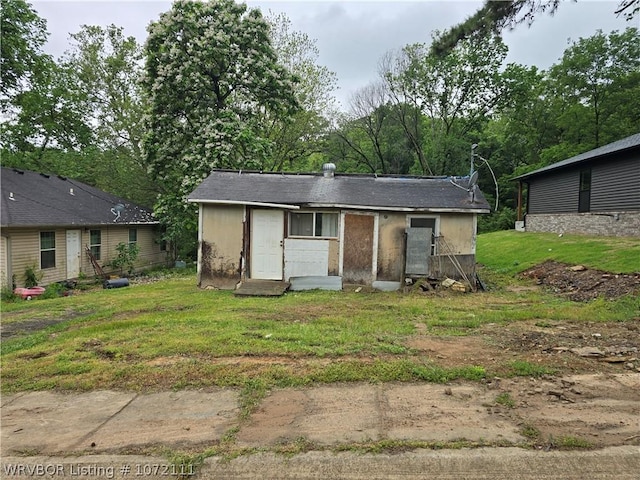 view of outbuilding with a yard