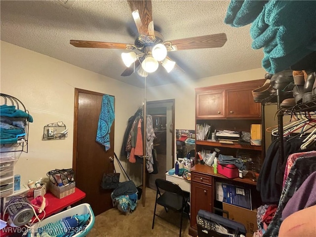 misc room featuring light carpet, ceiling fan, and a textured ceiling